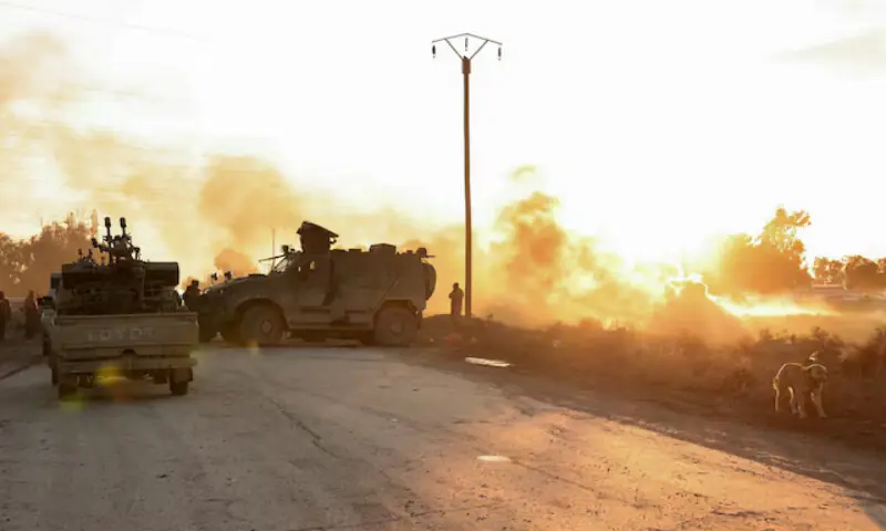 Military members gather near the Raqqa prison in Raqqa city of Syria. &ndash; Reuters