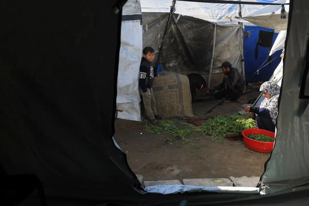 Displaced Palestinian families inside makeshift tents near the &lsquo;Yellow Line&rsquo;, in the east of Gaza City. &ndash; Reuters