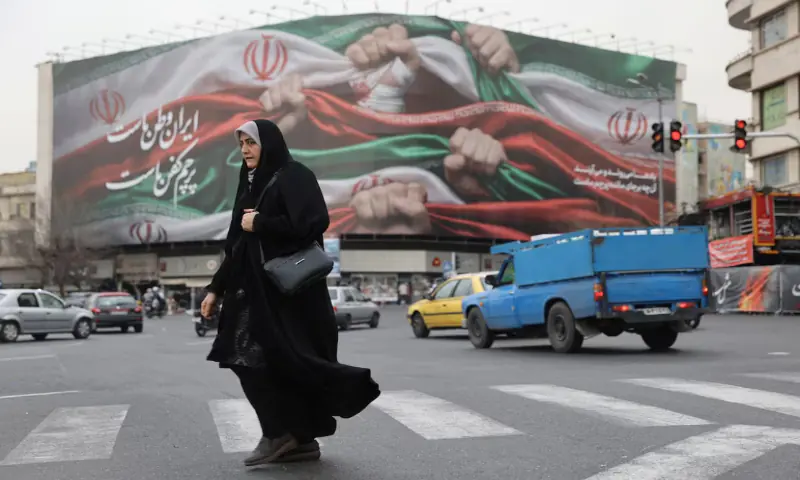 An Iranian woman walks on a street in Tehran, Iran. &ndash; Reuters