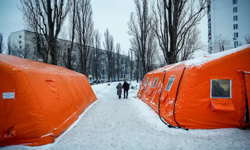 People pass by a Point of Invincibility centre, a government-run shelter which offers basic services and heat during blackouts in Kyiv, Ukraine. &ndash; Reuters