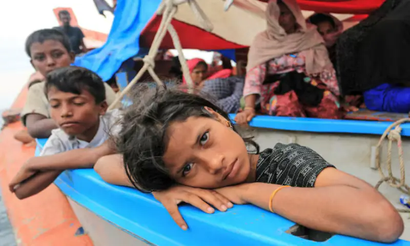 A Rohingya refugee child looks on as she is stranded due to a boat engine failure in the waters of South Aceh, Aceh province, Indonesia. &ndash; Reuters