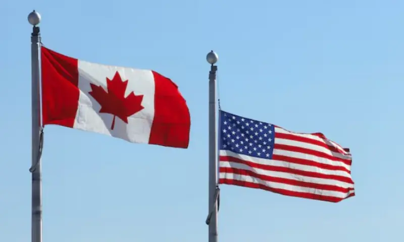 The Canadian and U.S. flags flutter at the Lansdowne Port of Entry next to the Thousand Islands Bridge in Lansdowne, Ontario, Canada, on February 12, 2025. Reuters file