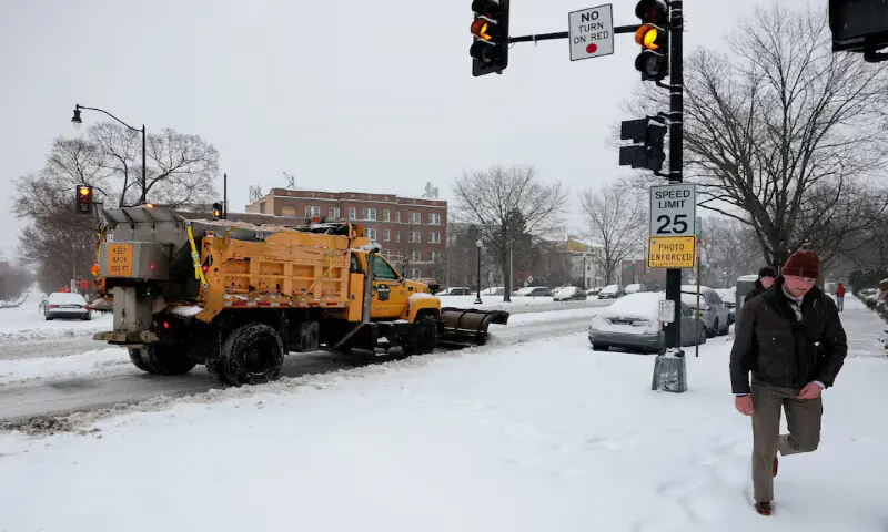 A snowplough truck works on the road in Washington, DC. &ndash; Reuters