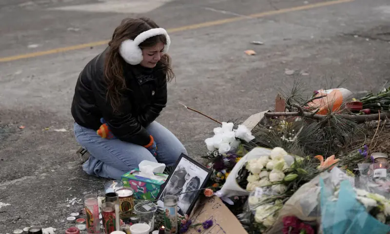 A person reacts at a makeshift memorial at the site where a man identified as Alex Pretti was fatally shot by federal immigration agents in Minneapolis, Minnesota. &ndash; Reuters