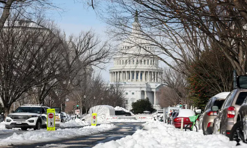 Snow covers a street near the US Capitol building in Washington, DC. &ndash; Reuters