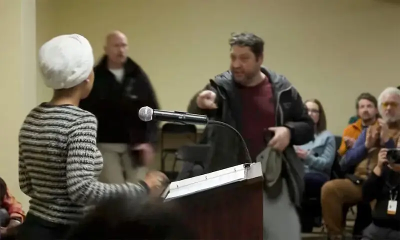 A man shouts at US Representative Ilhan Omar after spraying her during a town hall meeting in Minneapolis, Minnesota. – Reuters A man shouts at US Representative Ilhan Omar after spraying her during a town hall meeting in Minneapolis, Minnesota. – Reuters