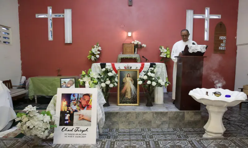 A priest conducts Mass during a memorial held by family members of Chad Joseph in Las Cuevas, Trinidad and Tobago. &ndash; Reuters
