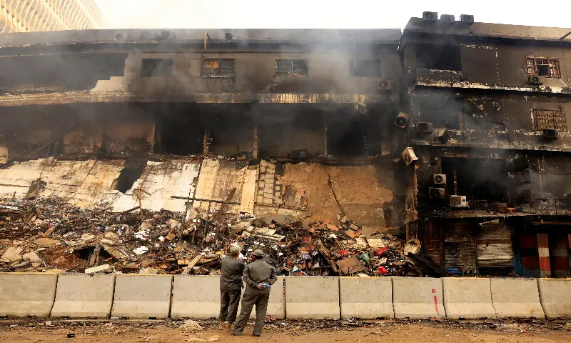 Smoke rises from the smouldering building of Gul Plaza in Karachi. &ndash; Reuters