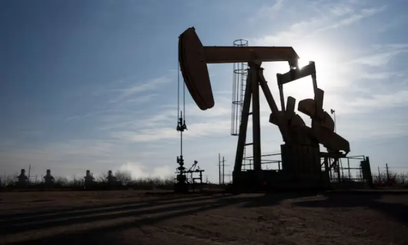 A pump jack operates near a gas turbine power plant in the Permian Basin oil field outside of Odessa, Texas, US. &ndash; Reuters