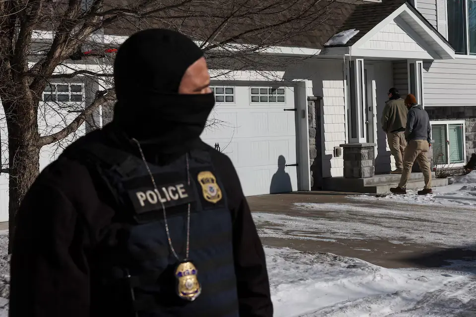 Federal agents with US Immigration and Customs Enforcement (ICE) conduct an immigration enforcement operation in Pine Grove, Minnesota, US. &ndash; Reuters