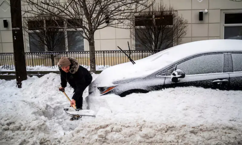 A man shovels snow to take out his car in Hoboken, New Jersey. &ndash; Reuters