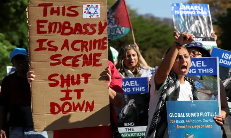 Activists hold placards and shout slogans outside Israel&rsquo;s embassy in Pretoria, South Africa. &ndash; Reuters file