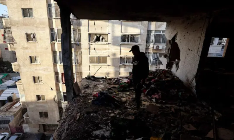 A Palestinian inspects the site of an Israeli strike in Gaza City on January 31, 2026. Reuters