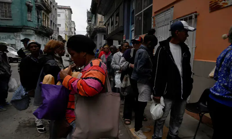 People line up to buy bread in Havana, Cuba. &ndash; Reuters