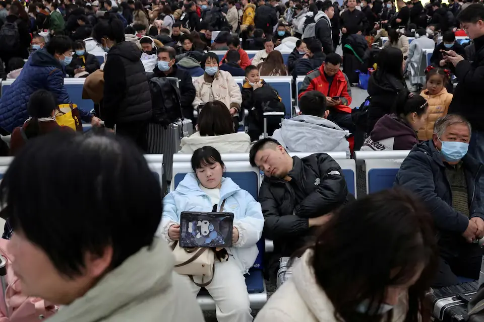 People wait in the waiting hall during the Spring Festival travel rush ahead of the Lunar New Year at Shanghai Hongqiao railway station in Shanghai, China. &ndash; Reuters