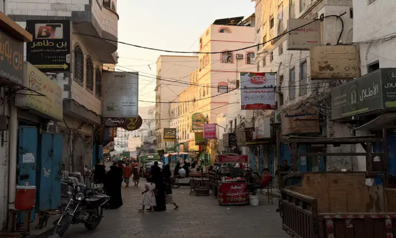 People walk through a traditional market in the port city of Mukalla, Hadramout, Yemen. &ndash; Reuters