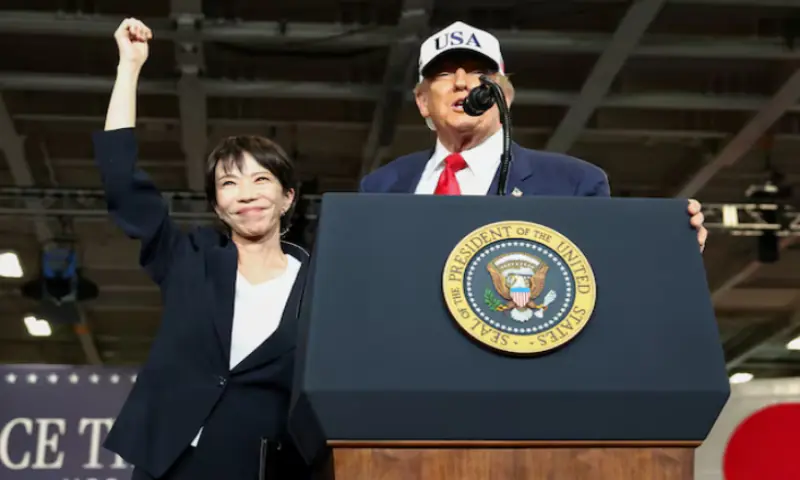 Japanese Prime Minister Sanae Takaichi gestures as US President Donald Trump speaks, aboard the aircraft carrier USS George Washington, during a visit to US Navy&rsquo;s Yokosuka base in Yokosuka, Japan. &ndash; Reuters