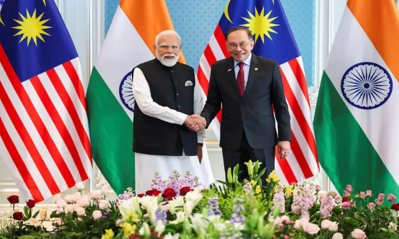 Malaysian Prime Minister Anwar Ibrahim shakes hands with Indian leader Narendra Modi in Putrajaya, Malaysia, on Sunday. &ndash; Reuters