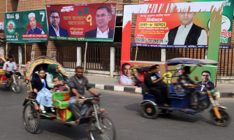 Vehicles pass by election campaign banners ahead of the national election, in Dhaka, Bangladesh. &ndash; Reuters