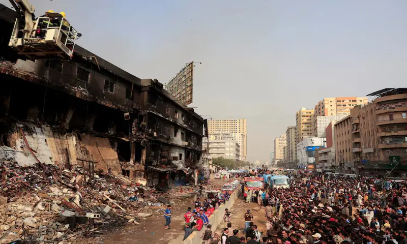 Emergency personnel search for survivors at the Gul Plaza Shopping Mall in Karachi. &ndash; Reuters file