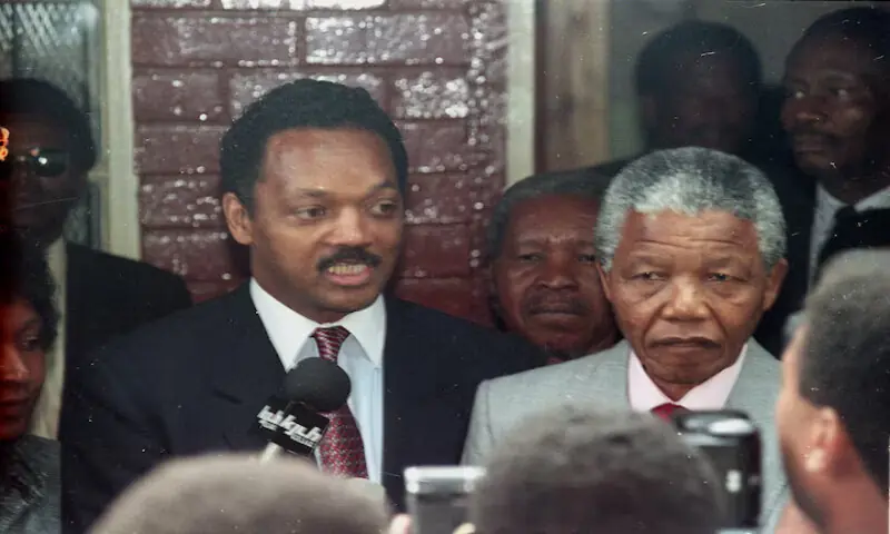Jesse Jackson and freed South African leader Nelson Mandela answer reporters&rsquo; questions at Mandela&rsquo;s Soweto house on February 15, 1990. &ndash; Reuters