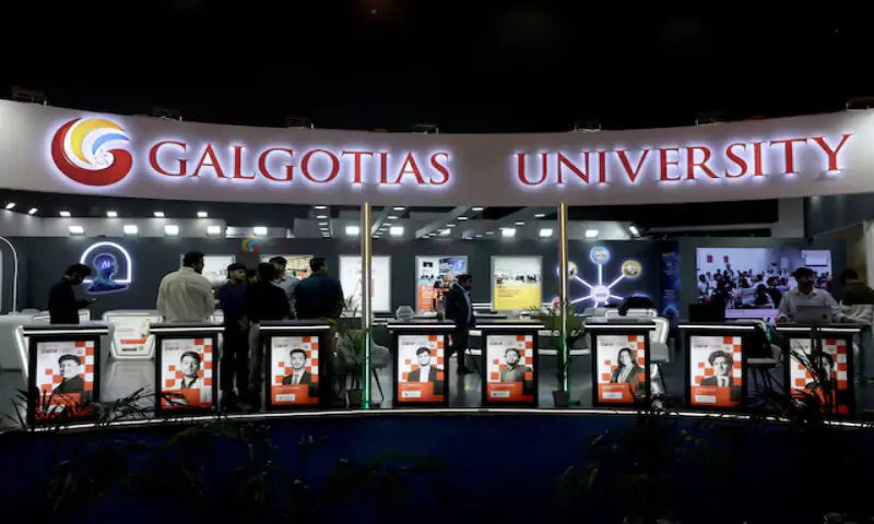 Visitors stand at the Galgotias University kiosk at Bharat Mandapam, one of the venues for AI Impact Summit, in New Delhi, India, on Wednesday. &ndash; Reuters