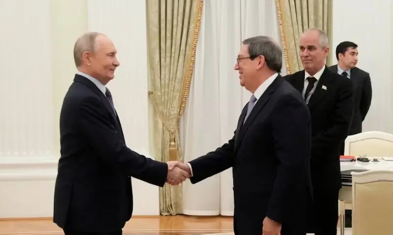 Russian President Vladimir Putin with Cuban Foreign Minister Bruno Rodriguez Parrilla. &ndash; Reuters