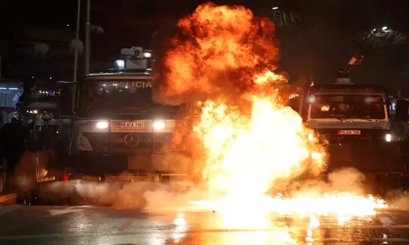 A petrol bomb explodes next to a police vehicle and officers wearing riot gear, during an anti-government protest by supporters of the Albanian opposition, triggered by a corruption investigation into Deputy Prime Minister Belinda Balluku, in Tirana, Albania. &ndash; Reuters