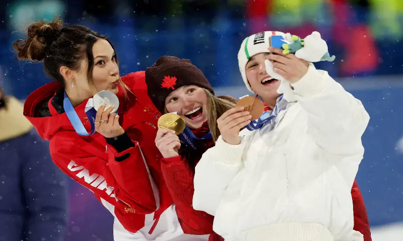 Gold medallist Megan Oldham of Canada, silver medallist Ailing Eileen Gu of China and bronze medallist Flora Tabanelli of Italy take a selfie on the podium after the Women&rsquo;s Freeski Big Air Final. &ndash; Reuters