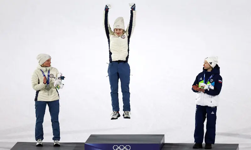 Gold medallist Anna Odine Stroem of Norway celebrates on the podium after winning the Women&rsquo;s Large Hill Individual final with silver medallist Eirin Maria Kvandal of Norway and bronze medallist Nika Prevc of Slovenia. &ndash; Reuters