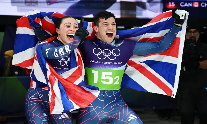 Tabitha Stoecker of Britain and Matt Weston of Britain celebrate after winning the gold medal in the Skeleton Mixed Team. &ndash; Reuters