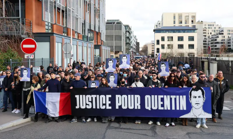 People carry a banner reading: &ldquo;Justice for Quentin&rdquo;, during a march in tribute to Quentin Deranque, a young far-right activist beaten to death during a violent assault by hard-left activists, in Lyon, France. &ndash; Reuters