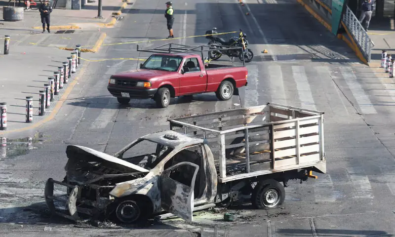The burned wreckage of a truck, used as a barricade by members of organised crime following a series of detentions by federal forces, lies in Guadalajara, Mexico. &ndash; Reuters