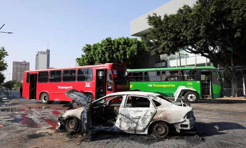 A burned vehicle used as barricade by organised crime members, following a series of arrests by federal forces, stands in Guadalajara, Mexico. &ndash; Reuters