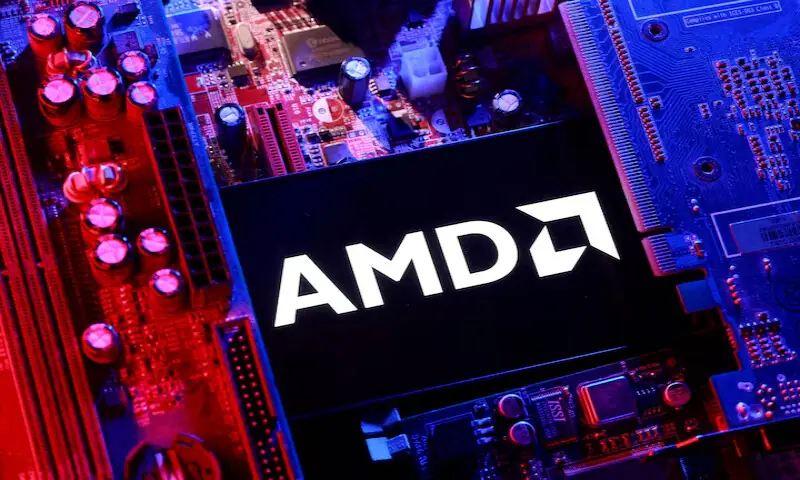 An AMD logo and a computer motherboard appear in this illustration. &ndash; Reuters