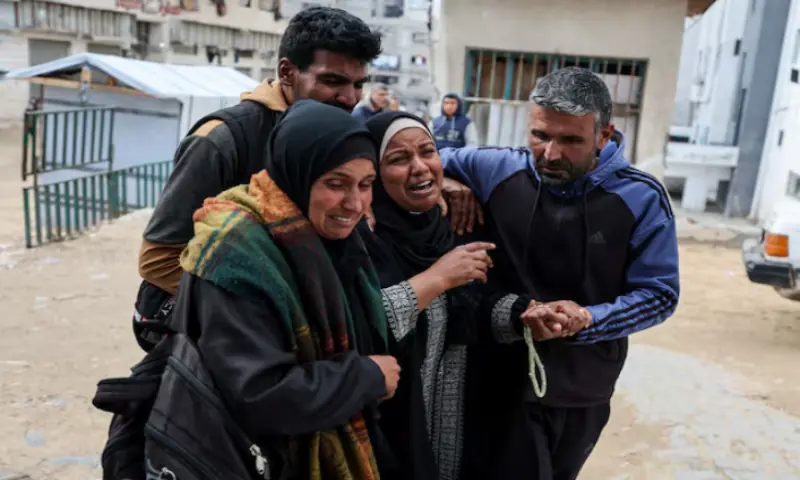 Mourners react during the funeral of two Palestinians killed by an Israeli strike on Thursday, according to medics, at Shifa hospital in Gaza City. &ndash; Reuters