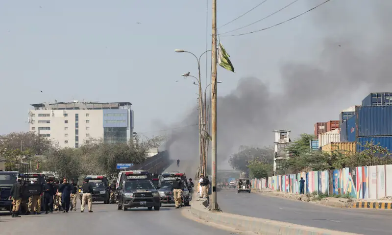 Police gather after a protest outside the US Consulate General in Karachi on Sunday. &ndash; Reuters