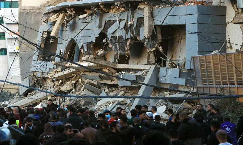 Rescuers gather at the site of an Israeli airstrike that targeted the Jamaa Islamiya offices in the southern Lebanese coastal city of Sidon on March 3, 2026. AFP