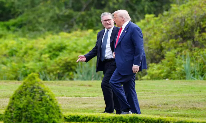 US President Donald Trump walks with British Prime Minister Keir Starmer at Trump International Golf Links in Aberdeen, Scotland, Britain. &ndash; Reuters file