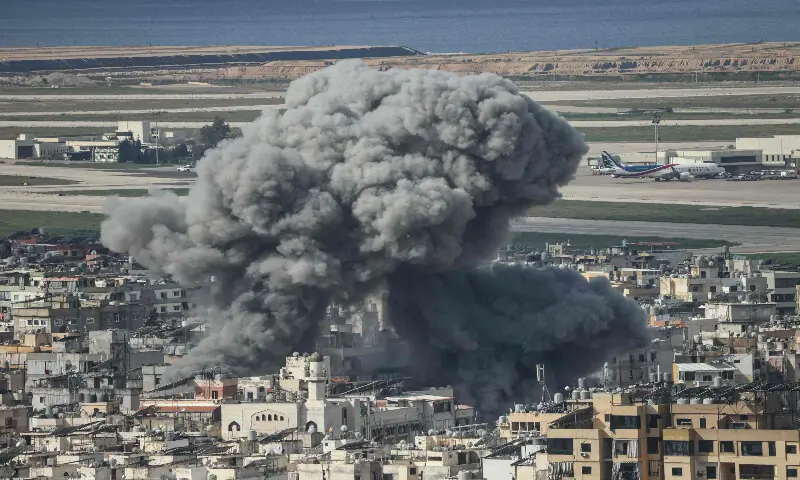 Smoke rises from the site of an Israeli airstrike that targeted the Al Lailaki neighbourhood in Beirut&rsquo;s southern suburbs, with the city&rsquo;s international airport visible in the background, on March 4, 2026. AFP