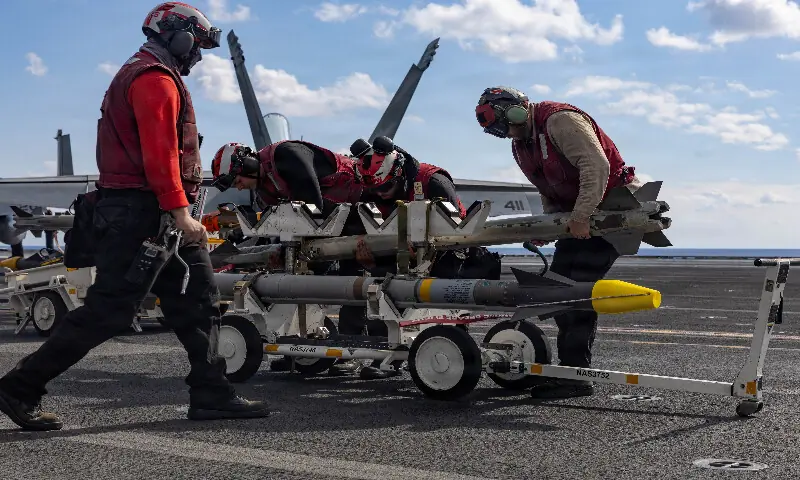 US navy sailors handle ordnance on the aircraft carrier USS Gerald R. Ford while operating in support of attacks on Iran in the eastern Mediterranean Sea. &ndash; Reuters