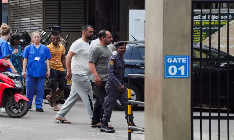 Injured Iranian sailors walk on Galle National Hospital premises where they are receiving treatment in Galle, Sri Lanka, on Thursday. &ndash; Reuters