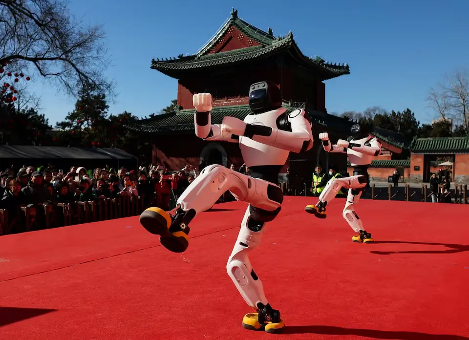 People watch as robots dance during Lunar New Year celebrations in Beijing. &ndash; Reuters