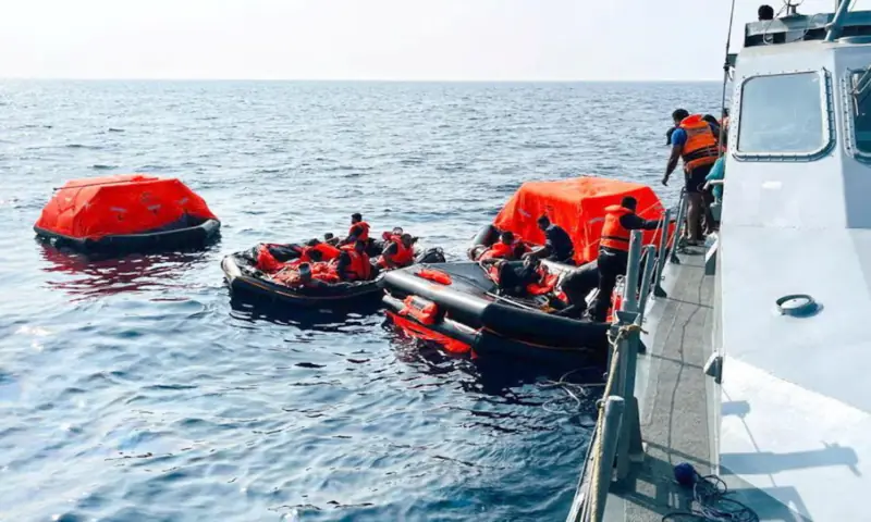 Sri Lanka Navy personnel assist Iranian sailors during a rescue operation after responding to a distress call from their vessel, the Iranian military ship IRIS Dena, within Sri Lanka&rsquo;s maritime search and rescue region, in the Indian Ocean. &ndash; Reuters