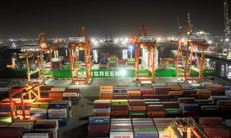 A drone view of an Evergreen container ship docked at the port of Umm Qasr during nighttime operations in Basra, Iraq. &ndash; Reuters