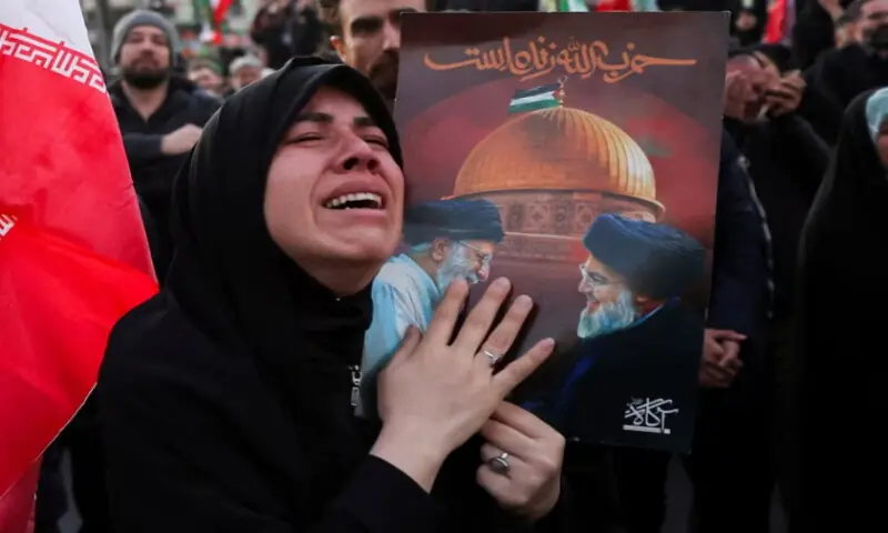 A woman reacts as people gather at the Enghelab Square, after Iran&rsquo;s Supreme Leader Ayatollah Ali Khamenei was killed on Saturday, in Tehran, Iran, on March 1. Reuters file