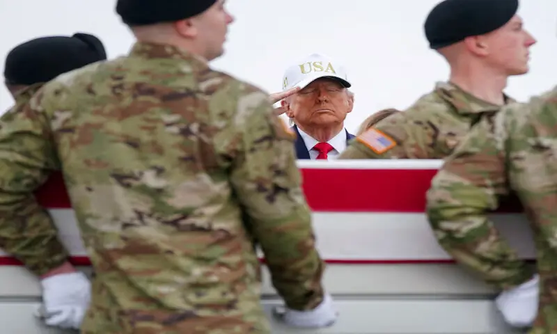 US President Donald Trump salutes as members of the military carry the remains of six US army service members who were killed in an Iranian strike, at Dover Air Force Base in Dover, Delaware. &ndash; Reuters