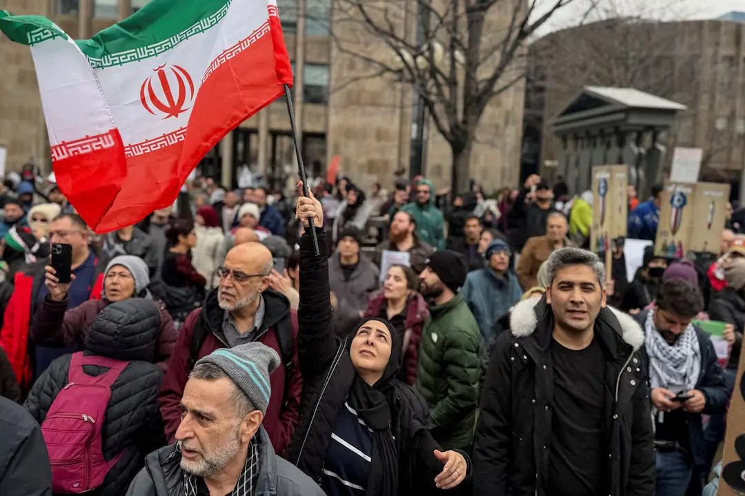 Protesters hold an Iranian flag near a rally by people supporting the Israel-U.S. conflict with Iran, in front of the U.S. consulate in Toronto, Ontario, Canada. – Reuters Protesters hold an Iranian flag near a rally by people supporting the Israel-U.S. conflict with Iran, in front of the U.S. consulate in Toronto, Ontario, Canada. – Reuters