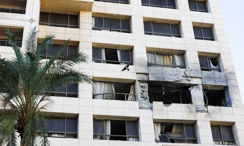 A bird flies next to the damaged Ramada Plaza hotel building in the aftermath of an Israeli strike in central Beirut, Lebanon. &ndash; Reuters