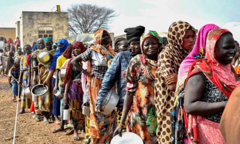 Women who fled the war-torn Sudan following the outbreak of fighting between the Sudanese army and the paramilitary Rapid Support Forces queue to receive food rations at the United Nations High Commissioner for Refugees transit centre in Renk. Reuters file